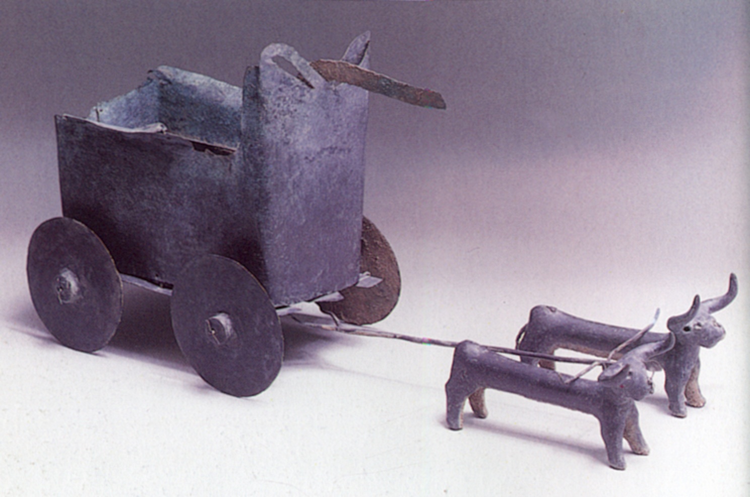 Ancient bronze model bull-driven cart
