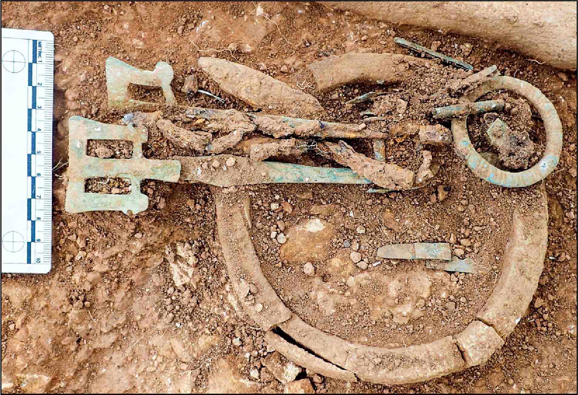 Ivory bag ring and girdle hangers associated with skeleton SK12 at Scremby, Lincolnshire.